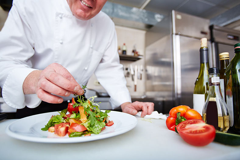 Chef prepares salad at Fratelli Italian Restuarant & Bar in LaVale, MD